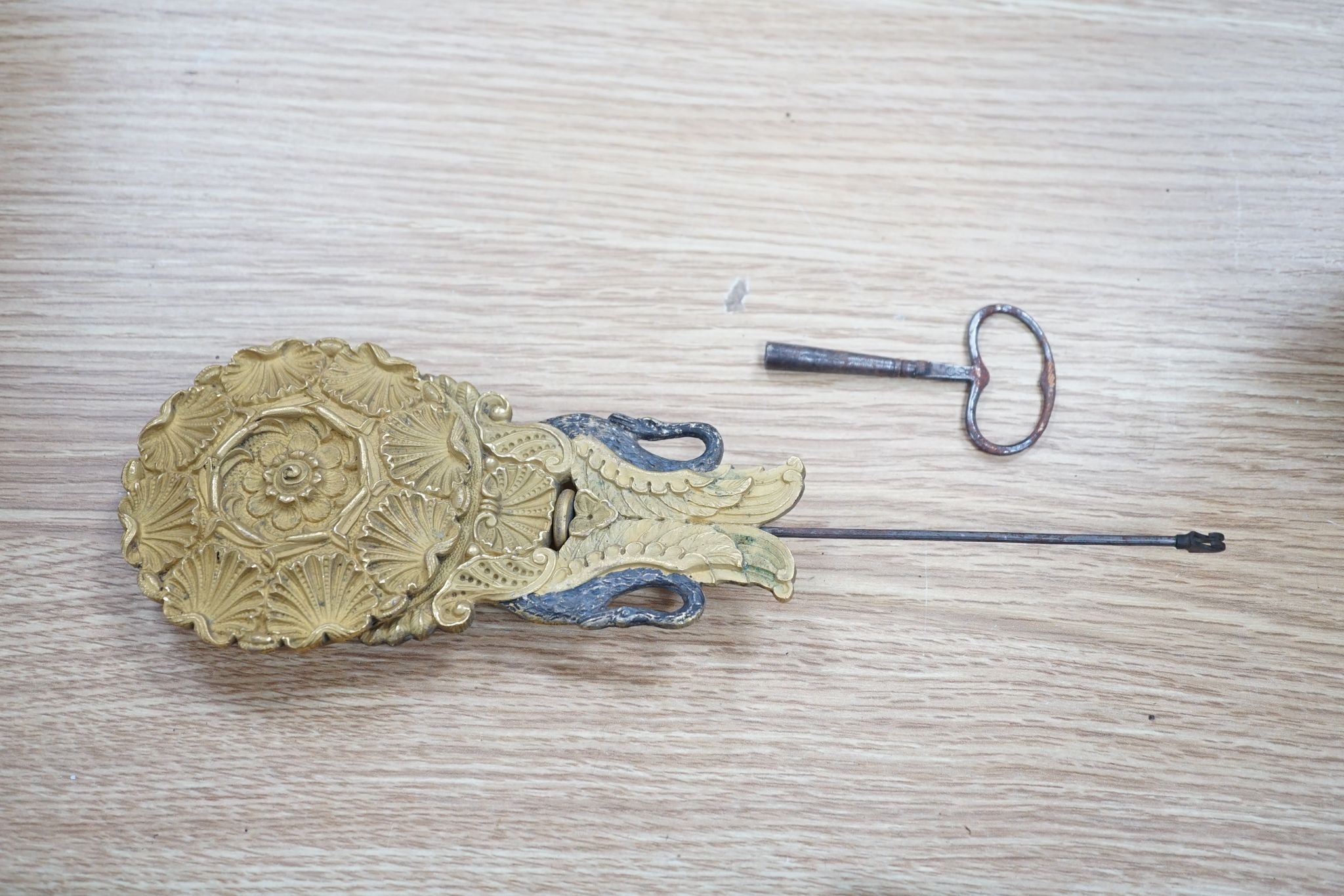 A 19th century French ebonised portico mantel clock with brass mounts, 47 cms high.